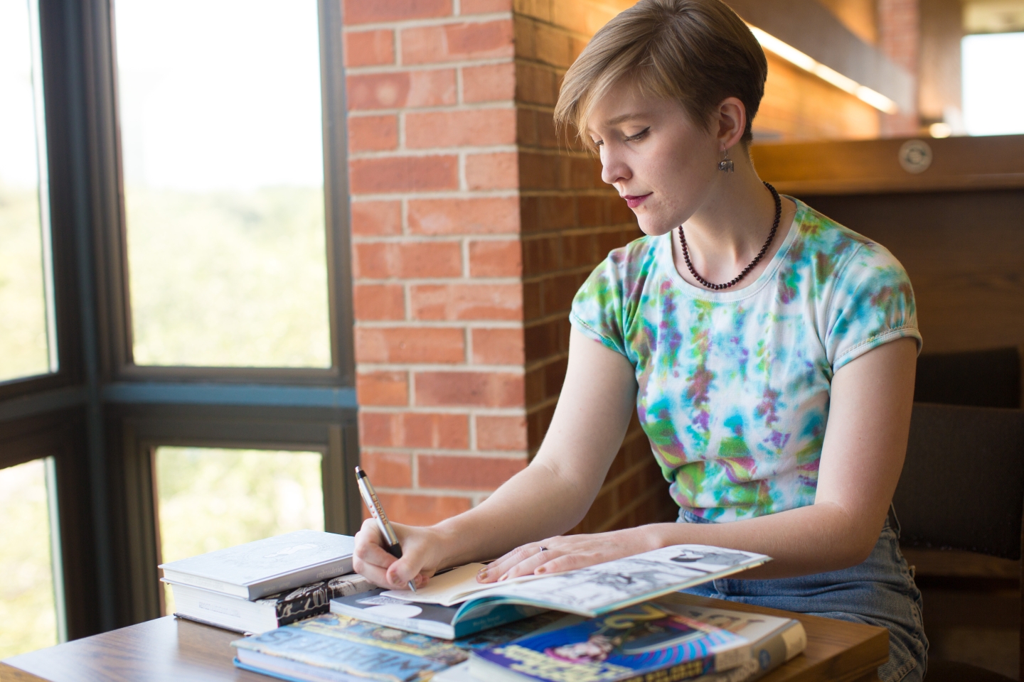 Student studying graphic novels in the library