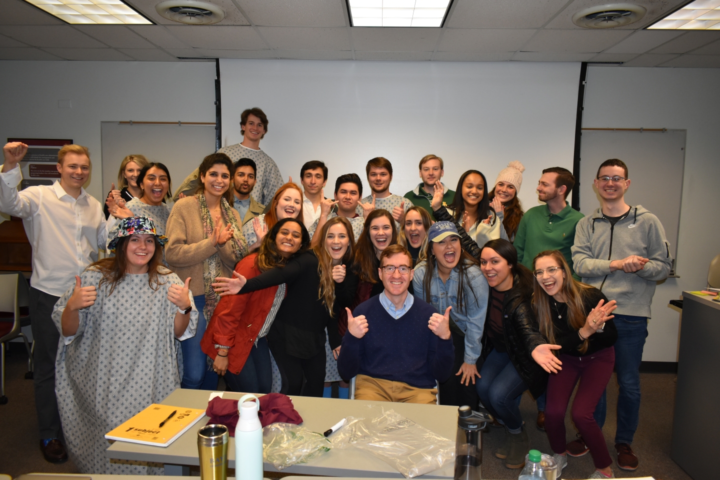 Students celebrate Dr. Shay who just received an award.