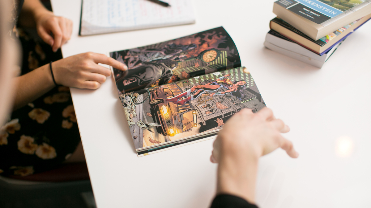 Students looking at comic book