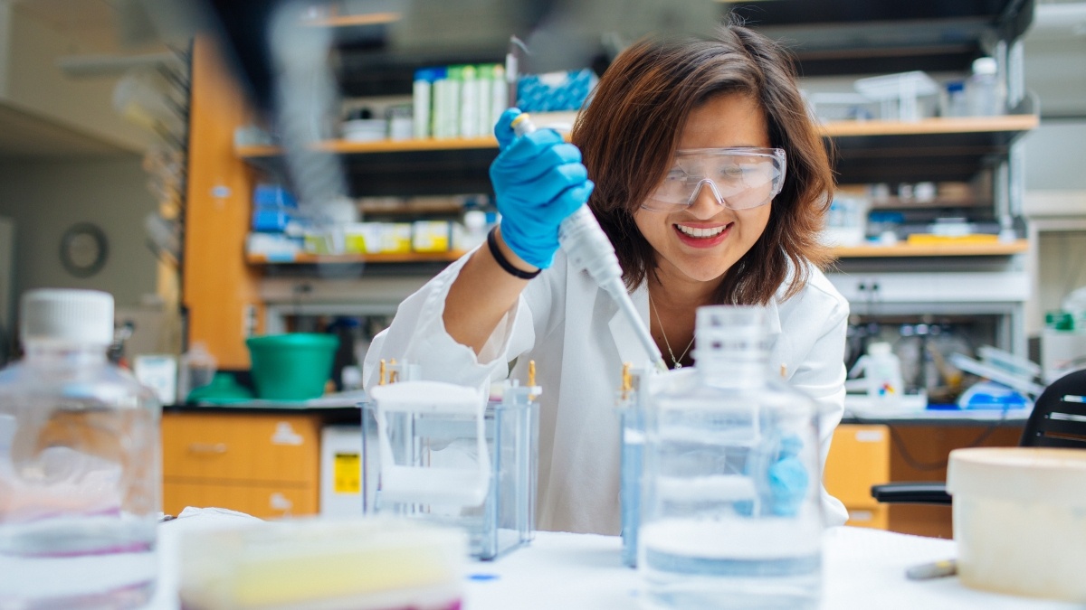 Female student conducting chemistry experiment