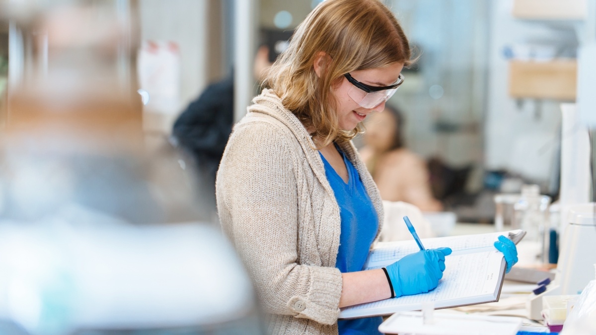 Student writing lab results