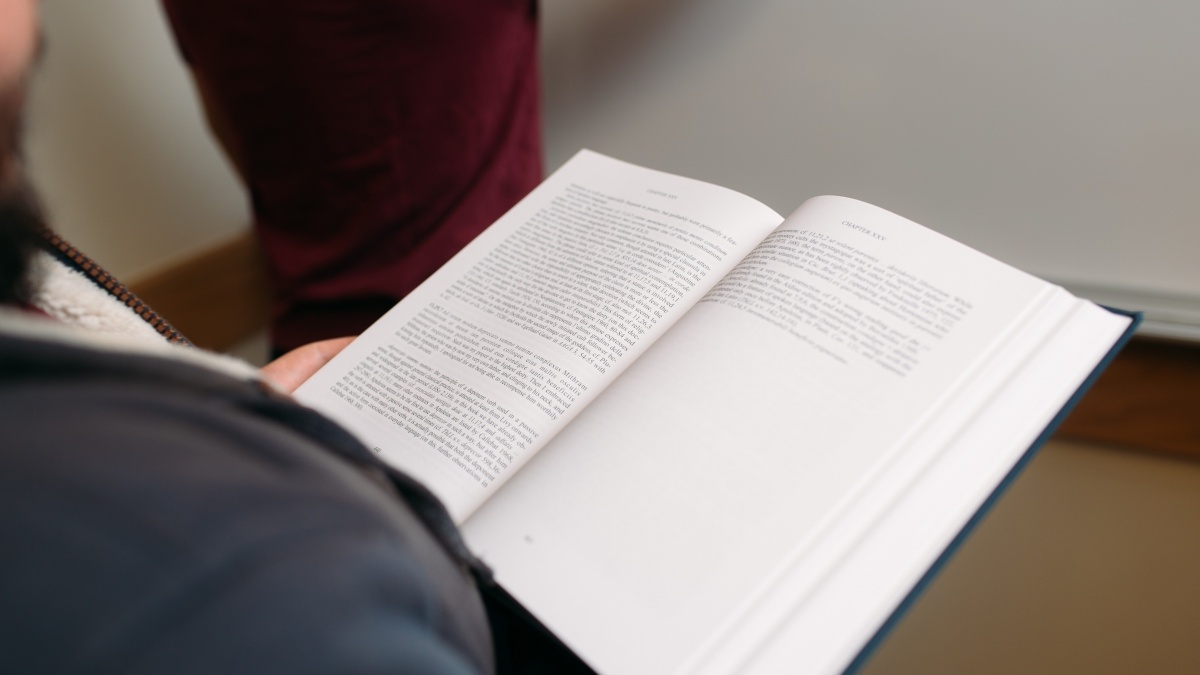 A book being held open