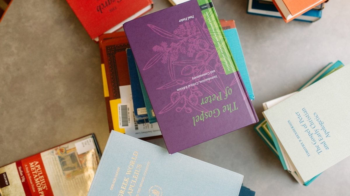 Multiple stacks of colorful music composition books