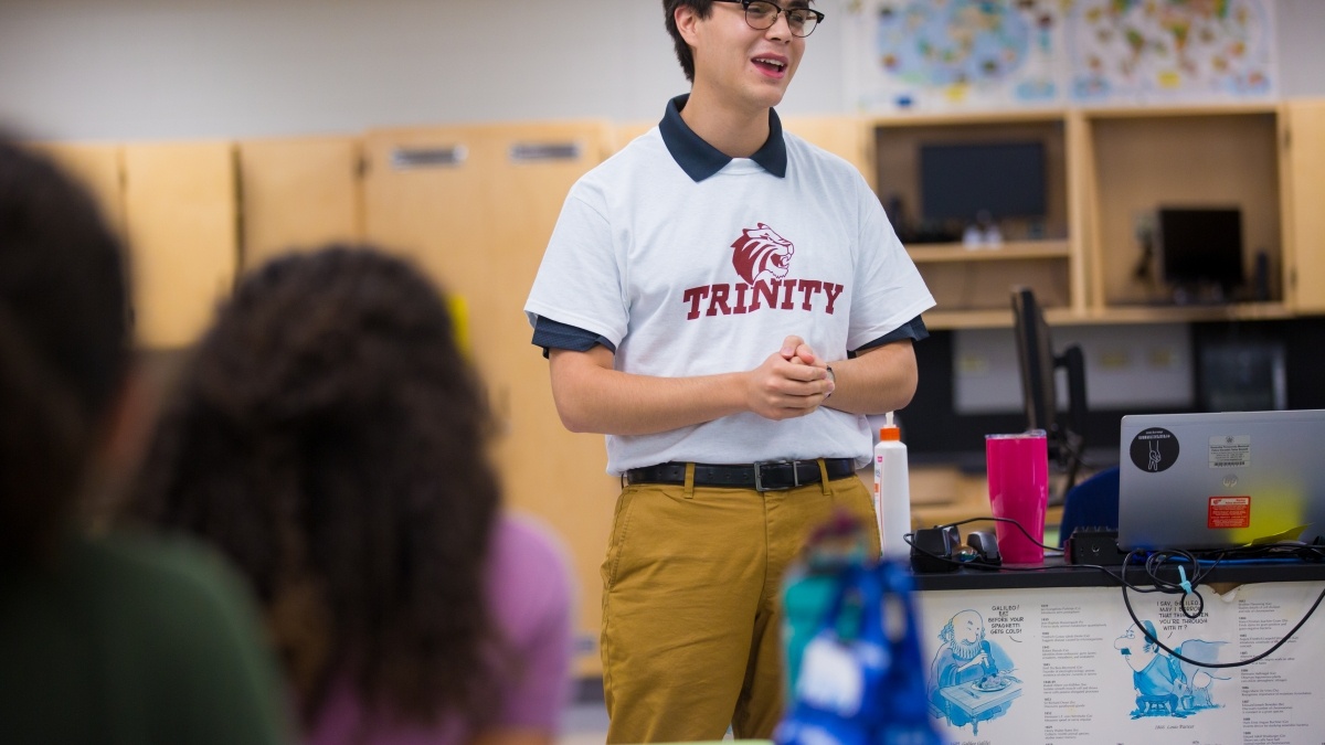 Trinity student speaking to high school class