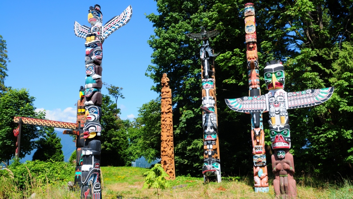 Native American idol statues in an open field